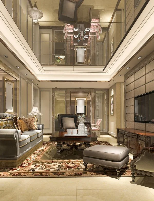 Luxury Neoclassical living room featuring a grand mirrored tray ceiling, ornate grey velvet sofas with fringe detail, and a large traditional floral Persian-style rug.